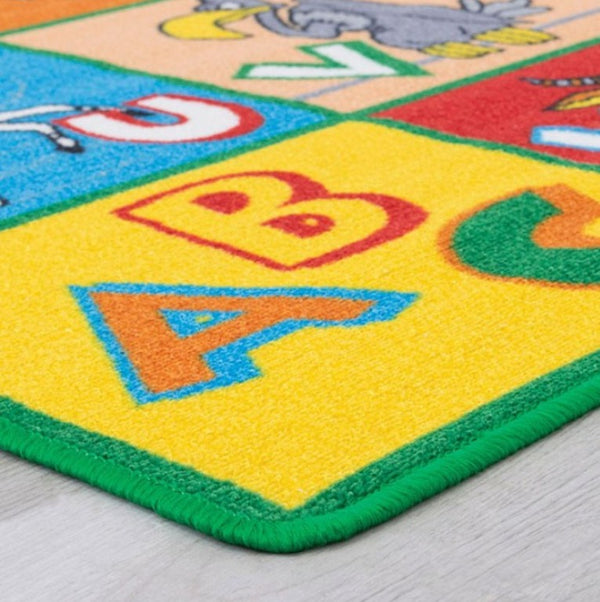 Brightstar ABC Animals Kids 5x8 Area Rug Colorful children's rug with letters and animals on a light gray floor.