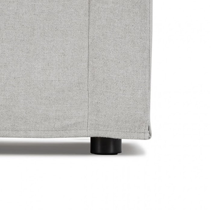 Bryant Sofa Linen Light Gray Fabric Gray sofa in a living room with a rug and wall art