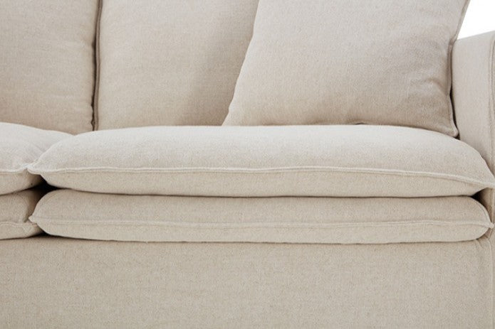 Bryant Sofa Linen Taupe Fabric White sofa in a living room with a painting on the wall