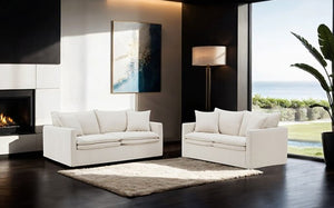 Bryant Sofa Linen Taupe Fabric Modern living room with white sofas, a fireplace, and large windows.