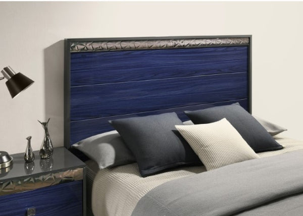 Burbandy Modern Glam Bed Bed with blue headboard and pillows in a bedroom setting