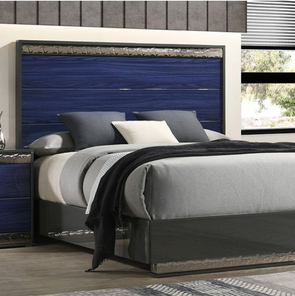 Burbandy Modern Glam Bed Modern bedroom with a bed featuring a blue headboard and gray bedding.