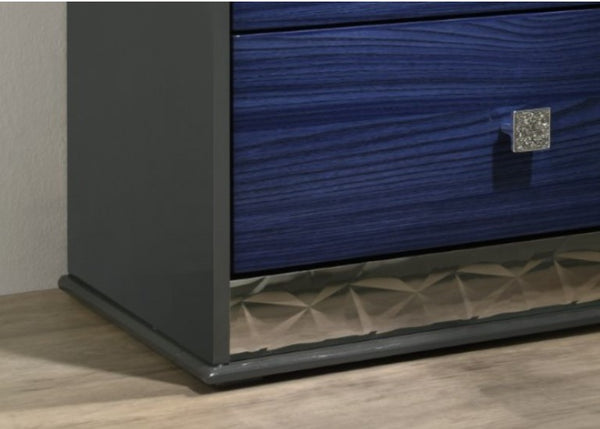 Burbandy Modern Glam Nightstand Close-up of a blue drawer with a metallic handle on a wooden floor.