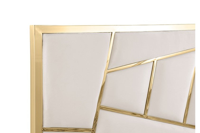 Burton Contemporary Glam White Gold Upholstered Bed A modern white upholstered bed with a geometric gold metal frame headboard, styled in a bright bedroom with white bedding, matching nightstands, gold lamps, and a gold ring pendant light.