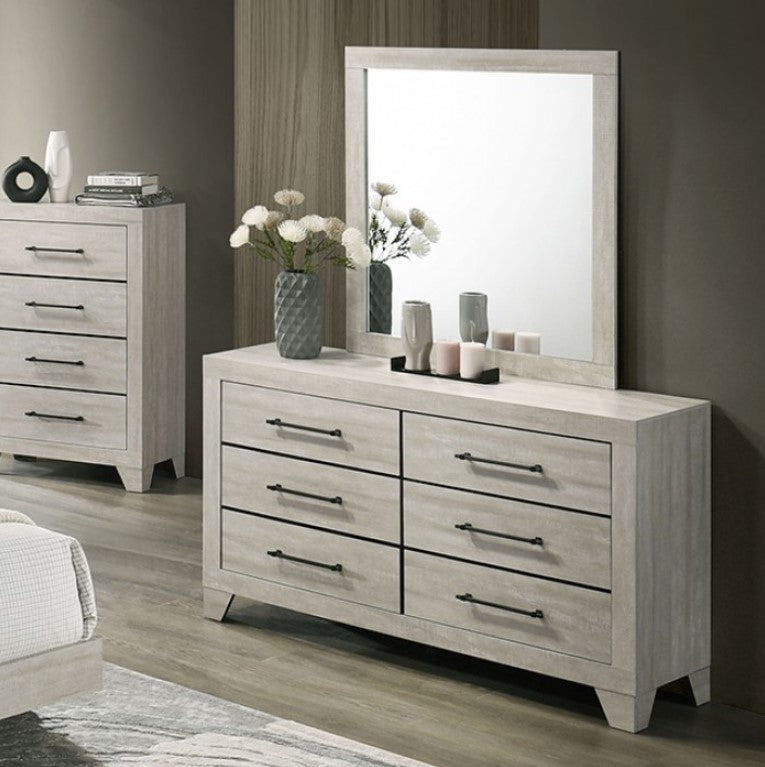 Wooden dresser with mirror in a bedroom setting