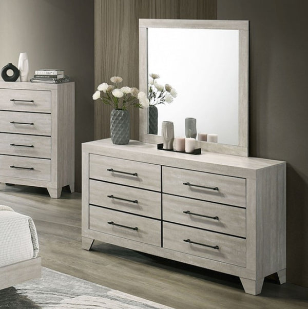 Wooden dresser with mirror in a bedroom setting