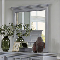 Cassie Transitional Gray Mirror Gray dresser with mirror, vases, and plants against a neutral wall