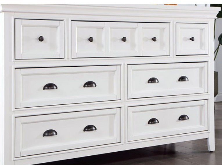 Cassie Transitional White Dresser White dresser with mirror in a room with a window and decorative items.