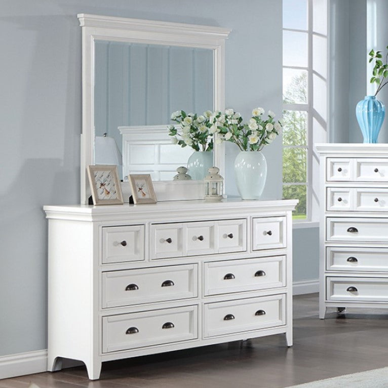 Cassie Transitional White Mirror White dresser with mirror and decorative items against a light blue wall