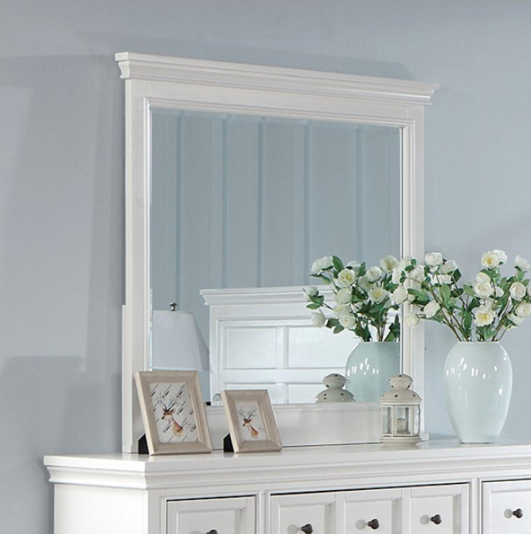 Cassie Transitional White Mirror White dresser with mirror and decorative items against a light blue wall