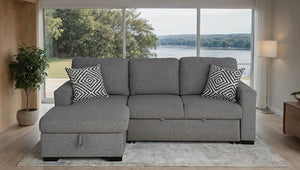 Chiller Gray Contemporary Style Pull Out Sleeper Sectional Sofa Gray sectional sofa with patterned pillows in a living room with large windows.