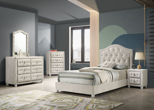 Chloe Beige Fabric Full Upholstered Kids Bed A modern bedroom furniture set featuring an off-white tufted bed frame, matching dresser, chest, and nightstand, styled in a contemporary bedroom with gray walls and a geometric rug.