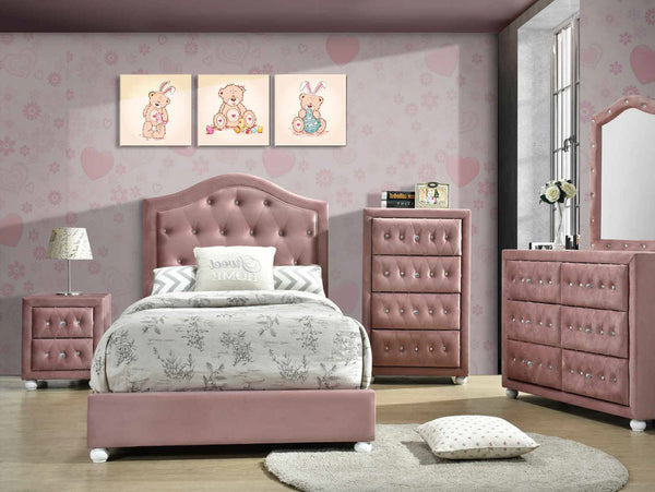 Chloe Pink Fabric Full Upholstered Kids Bed A pink upholstered children's bedroom furniture set including a bed frame with a tufted headboard, matching nightstands, a tall dresser, a larger chest of drawers, and a mirror, arranged in a room with pink heart-patterned wallpaper and three framed bunny illustrations.