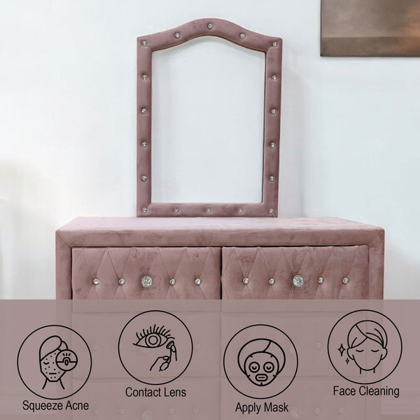 Pink vanity with mirror and drawers on a white background