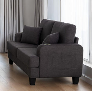 Cidney Contemporary Dark Gray Fabric Loveseat Gray sofa with cushions in a room with curtains and a window.