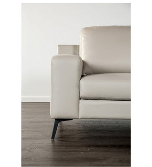 Beige sofa with a wooden floor and white wall background