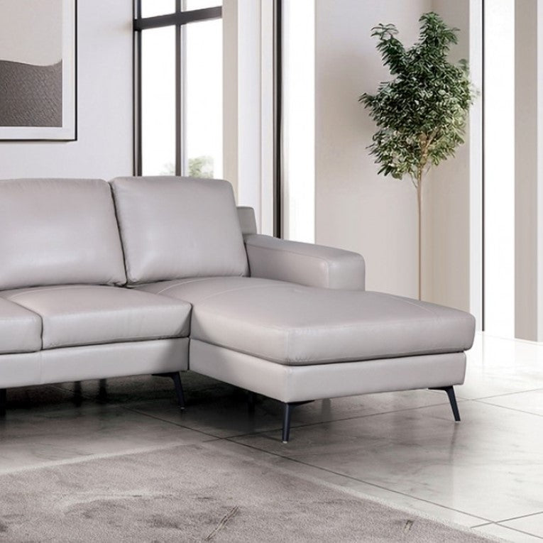 Dante Leather Match Light Gray Sectional Sofa Gray sectional sofa in a modern living room with large windows and minimal decor.