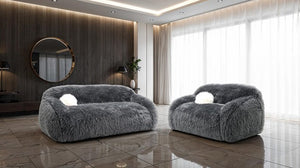Dareen Contemporary Gray Faux Fur Sofa with Ball Pillows Two gray fluffy armchairs in a modern living room with large windows.