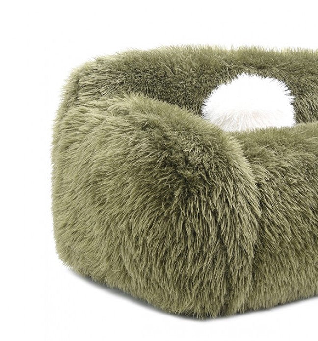 Dareen Contemporary Green Faux Fur Sofa with Ball Pillows Green fluffy sofa with a white ball on a marble floor.