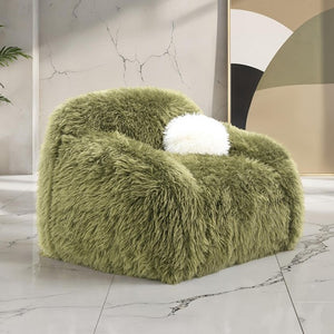 Dareen Contemporary Green Faux Fur Swivel Chair with Ball Pillows Green fluffy armchair with a white cushion on a marble floor.
