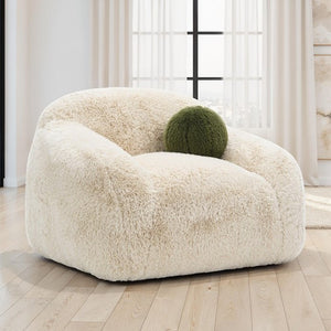 Dareen Contemporary Sand Faux Fur Swivel Chair with Ball Pillows Fluffy white armchair with a green ball on a wooden floor