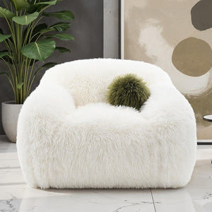 Dareen Contemporary White Faux Fur Swivel Chair with Ball Pillows White fluffy chair with a green ball in a room with a plant and abstract art.