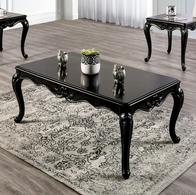 Darian Black Coffee Table Carved Details Cabriole Legs Black coffee table with decorative items on a patterned rug in a room with other tables.