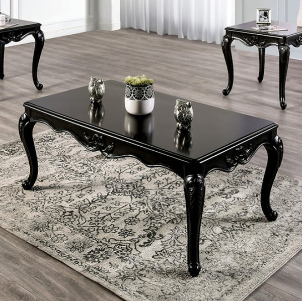 Darian Black Coffee Table Carved Details Cabriole Legs Black coffee table with decorative items on a patterned rug in a room with other tables.