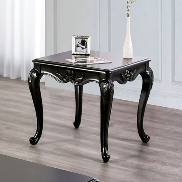 Darian Black End Table Carved Details Cabriole Legs Black ornate side table with decorative elements on a wooden floor.