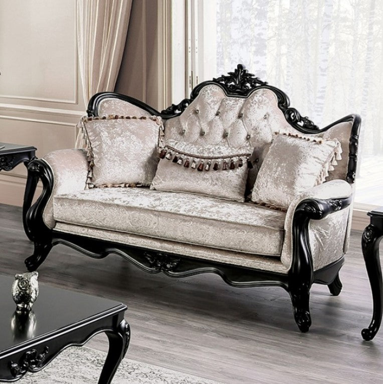 Darian Diamond Tufted Traditional Style Loveseat Decorative sofa with intricate carvings in a room with light-colored walls and curtains.