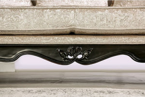 Decorative stone ledge with intricate carvings and a black metal strip.
