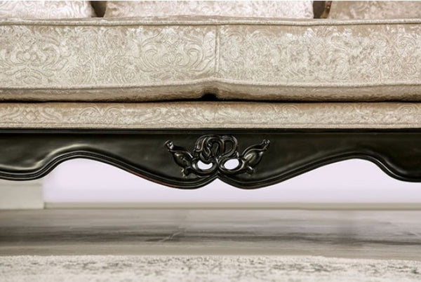 Decorative stone ledge with intricate carvings and a black metal strip.