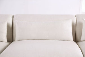 Debron Linen White Sectional Sofa Beige sofa against a white wall
