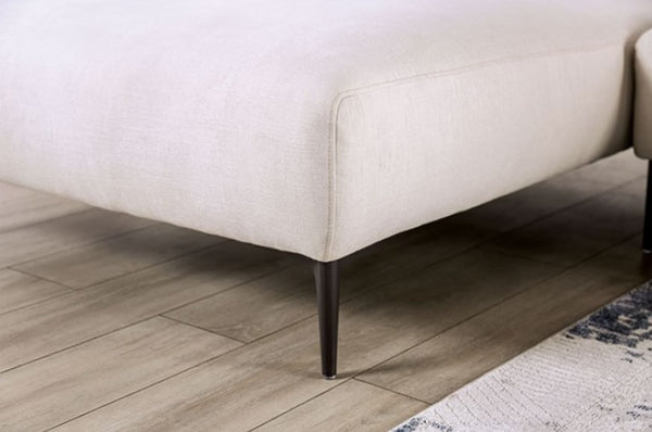 Beige sofa corner on a wooden floor with a rug