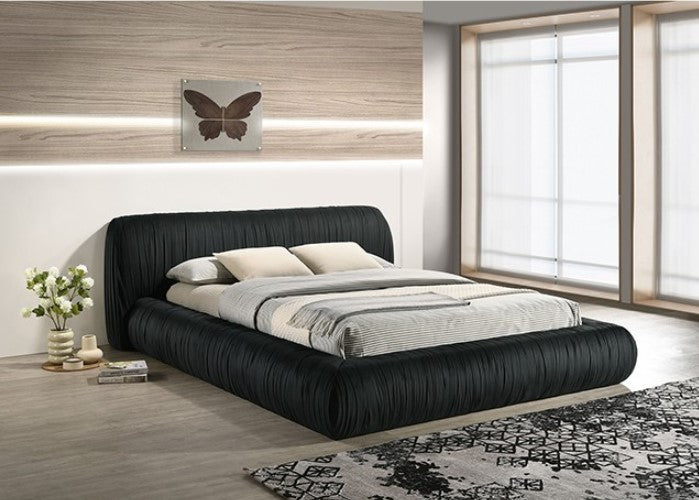 Decodale Black Fabric Pleated Fully Upholstered Platform Bed Modern bedroom with a black upholstered bed and decorative elements.