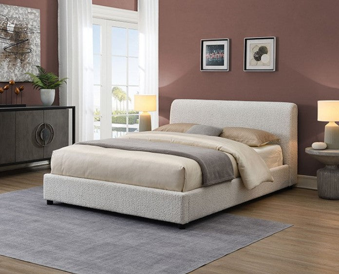 Doira Modern  Style Upholstered Bed White Finish Beige upholstered bed in a room with a large window and decorative elements.
