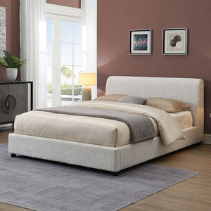 Doira Modern  Style Upholstered Bed White Finish Beige upholstered bed in a room with a large window and decorative elements.