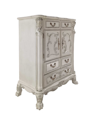 Dresden Bone White Traditional Style Chest An ornate vintage-style chest of drawers in a distressed off-white finish, featuring carved details, four drawers, two central doors with decorative panels, and carved legs, shown against a plain white background.