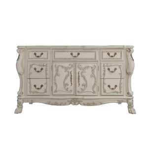 Dresden Bone White Traditional Style Dresser An ornate vintage-style sideboard or dresser in a distressed off-white finish, featuring carved floral details, multiple drawers, and cabinet doors with antique bronze handles.