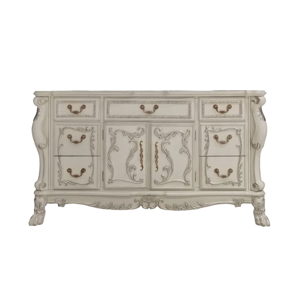 Dresden Bone White Traditional Style Dresser An ornate vintage-style sideboard or dresser in a distressed off-white finish, featuring carved floral details, multiple drawers, and cabinet doors with antique bronze handles.