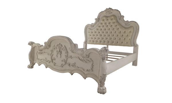 Dresden Bone White Traditional Silhouette Upholstered Bed An ornate baroque-style bed frame in a distressed off-white finish, featuring a tufted upholstered headboard and matching carved footboard, shown against a plain white background.