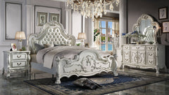 Dresden Bone White Traditional Silhouette Upholstered Bed Elegant bedroom set with a large bed, dresser, and nightstands in a stylish room.
