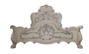 Dresden Bone White Traditional Silhouette Leaf Carving Inlay Bed An ornate, baroque-style upholstered headboard in a distressed off-white/cream fabric with dark gray carved detailing, shown against a plain white background.