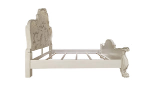Dresden Bone White Traditional Silhouette Leaf Carving Inlay Bed A white wooden bed frame with ornate carved details on the headboard and footboard, shown from a side angle against a plain white background.