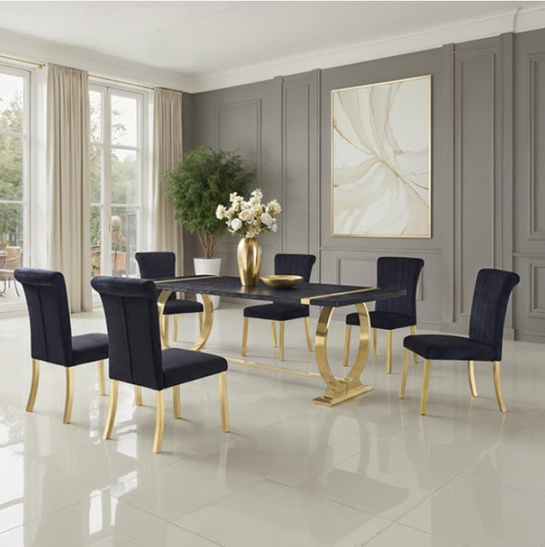 Editta Modern Glam Gold Black Dining Table Dining room with a black and gold table and chairs in a modern interior setting.