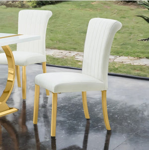 Editta Modern Glam Gold White Dining Chair White chairs with gold legs on a reflective surface, grassy area in the background