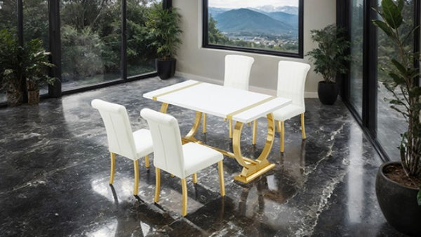 Editta Modern Glam Gold White Dining Table Modern dining table with white chairs on a black marble floor, large windows in the background.