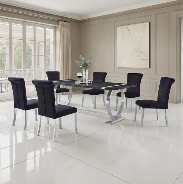 Editta Modern Glam Silver Black Dining Chair Black upholstered chairs with silver legs in a modern interior setting.