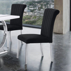 Editta Modern Glam Silver Black Dining Chair Black upholstered chairs with silver legs in a modern interior setting.