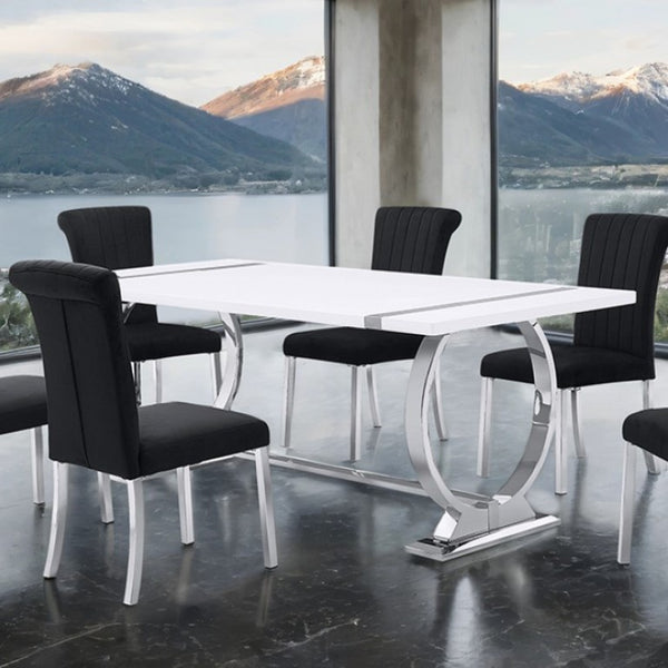 Editta Modern Glam Silver White Dining Table Modern dining table with black chairs in a room with large windows overlooking mountains and water.